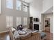 Bright living room with vaulted ceilings, a fireplace, and an adjacent bedroom at 244 Winding Oak Way, Clayton, NC 27520