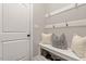 Mudroom with storage bench, shoe storage and hooks at 244 Winding Oak Way, Clayton, NC 27520