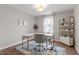 Home office featuring a modern desk, stylish rug, and bookshelf at 244 Winding Oak Way, Clayton, NC 27520