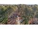 Aerial view of the home with driveway lined with trees at 2501 Huntsman Trl, Zebulon, NC 27597