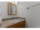 Bathroom vanity featuring granite counter and oak cabinets at 2501 Huntsman Trl, Zebulon, NC 27597