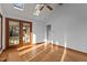 Bright bonus room featuring hardwood flooring, a ceiling fan, and access to a screened-in porch at 2501 Huntsman Trl, Zebulon, NC 27597