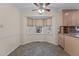 Bright breakfast nook area with bay windows and tiled flooring at 2501 Huntsman Trl, Zebulon, NC 27597