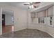 Cozy breakfast nook with a ceiling fan and large windows, perfect for morning meals at 2501 Huntsman Trl, Zebulon, NC 27597
