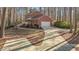 Brick home with a long driveway and attached garage at 2501 Huntsman Trl, Zebulon, NC 27597