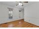 Spacious living room with hardwood floors, natural light, and neutral walls at 2501 Huntsman Trl, Zebulon, NC 27597