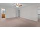 Spacious bedroom with carpeted floors, walk-in closet, and neutral color palette at 2501 Huntsman Trl, Zebulon, NC 27597