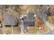 Aerial shot of property featuring a main house, shed, driveway, mature trees and landscaping at 2503 Mckinney St, Burlington, NC 27217