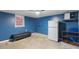 Basement with plenty of storage, plus refrigerator, sink, and exterior doors at 2503 Mckinney St, Burlington, NC 27217
