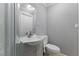 Cozy bathroom featuring a toilet, vanity with sink, mirror, and framed shower with glass door at 2503 Mckinney St, Burlington, NC 27217