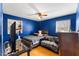 Bright bedroom with hardwood floors, ceiling fan, and a comfortable queen bed at 2503 Mckinney St, Burlington, NC 27217