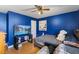 Bedroom featuring a ceiling fan, large tv and comfortable bed at 2503 Mckinney St, Burlington, NC 27217