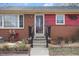 Close up of home's front porch, landscaped garden bed, and large front window at 2503 Mckinney St, Burlington, NC 27217