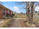 A home with stone walkway, established yard, and mature trees in a quiet neighborhood at 2503 Mckinney St, Burlington, NC 27217