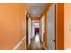 Hallway featuring hardwood floors, neutral paint, and access to bedrooms at 2503 Mckinney St, Burlington, NC 27217