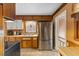 Kitchen has dark appliances, white cabinets, and a window for natural light at 2503 Mckinney St, Burlington, NC 27217