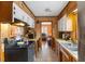 Kitchen includes dark appliances, light wood cabinets, and an eat-in dining area at 2503 Mckinney St, Burlington, NC 27217