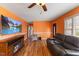 Bright living room featuring hardwood floors, modern furniture and a ceiling fan at 2503 Mckinney St, Burlington, NC 27217
