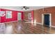 Bright living room featuring hardwood floors and exposed brick detail at 2503 Mckinney St, Burlington, NC 27217