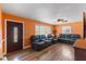 Open-concept living room featuring hardwood floors, with lots of seating and natural light at 2503 Mckinney St, Burlington, NC 27217