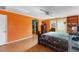 Bright main bedroom with a queen bed, a ceiling fan, and sliding door access to the exterior at 2503 Mckinney St, Burlington, NC 27217