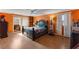 Bright main bedroom with a queen bed, a ceiling fan, and a large sliding door to the exterior at 2503 Mckinney St, Burlington, NC 27217