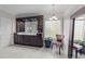 Main bath with double vanity, granite countertop, custom cabinets, and bright vanity lighting at 2504 Wertherson Ln, Raleigh, NC 27613