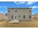 This is the back exterior of the home with vinyl siding, a concrete patio, and a door leading to the backyard at 2728 Spring Valley Dr, Creedmoor, NC 27522