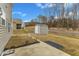 This backyard is complete with vinyl siding, a shed, a concrete patio, and a well-maintained lawn at 2728 Spring Valley Dr, Creedmoor, NC 27522