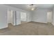 Cozy bedroom featuring plush carpeting, ceiling fan, and easy access to closet storage at 2728 Spring Valley Dr, Creedmoor, NC 27522