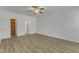 A spacious bedroom with luxury vinyl plank flooring and a ceiling fan offers an open doorway to the closet at 2728 Spring Valley Dr, Creedmoor, NC 27522