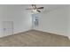Carpeted bedroom featuring a bright window and a door for optimal light and privacy at 2728 Spring Valley Dr, Creedmoor, NC 27522