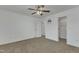 Relaxing bedroom with ceiling fan, carpet, and closet access, creating a serene space at 2728 Spring Valley Dr, Creedmoor, NC 27522