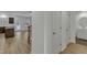 Welcoming entryway with light wood floors, a convenient half bath, and an open floor plan to the kitchen at 2728 Spring Valley Dr, Creedmoor, NC 27522