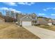 Well-maintained home with a two-car garage, long driveway, and spacious yard with a manicured lawn at 2728 Spring Valley Dr, Creedmoor, NC 27522