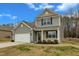 Well-maintained two-story home with a two-car garage, lovely lawn, and cozy front porch at 2728 Spring Valley Dr, Creedmoor, NC 27522