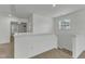 Hallway featuring natural light and plush carpeting, connecting living spaces at 2728 Spring Valley Dr, Creedmoor, NC 27522