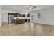 Modern kitchen with stainless steel appliances, granite countertops, and light wood flooring at 2728 Spring Valley Dr, Creedmoor, NC 27522
