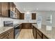 New kitchen with stainless appliances, granite countertops, kitchen island and white subway tile backsplash at 2728 Spring Valley Dr, Creedmoor, NC 27522