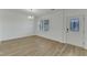 Bright living room with hardwood floors, large window, and modern light fixture at 2728 Spring Valley Dr, Creedmoor, NC 27522