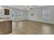 Spacious living space featuring light wood floors, ample natural light, and an open layout to the kitchen at 2728 Spring Valley Dr, Creedmoor, NC 27522