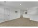 The upstairs loft area features neutral carpet and a mounted TV fixture, ready for your decor and enjoyment at 2728 Spring Valley Dr, Creedmoor, NC 27522