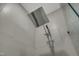 The modern bathroom features a rainfall showerhead with decorative tile accents in the luxurious walk-in shower at 2728 Spring Valley Dr, Creedmoor, NC 27522