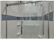 A modern glass shower with a rainfall showerhead, wall niches, and decorative tile accents offers style and function at 2728 Spring Valley Dr, Creedmoor, NC 27522