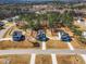 Aerial view of new homes in a wooded neighborhood, showcasing the community's layout and landscaping at 286 Beacon Hill Rd, Lillington, NC 27546