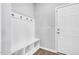 Well-organized entryway with coat rack, bench seating, and convenient access to the front door at 286 Beacon Hill Rd, Lillington, NC 27546
