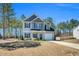 Charming two-story home with attached garage, long driveway, and well-maintained landscaping at 286 Beacon Hill Rd, Lillington, NC 27546