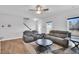 Comfortable living room featuring modern furnishings, a ceiling fan, and lots of natural light at 286 Beacon Hill Rd, Lillington, NC 27546