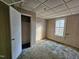 Bedroom featuring a window, closet, and light and blue carpeting in need of repair at 306 Martin Luther King Jr Dr, Smithfield, NC 27577