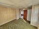 Bedroom featuring a doorway and light and green carpeting in need of repair at 306 Martin Luther King Jr Dr, Smithfield, NC 27577